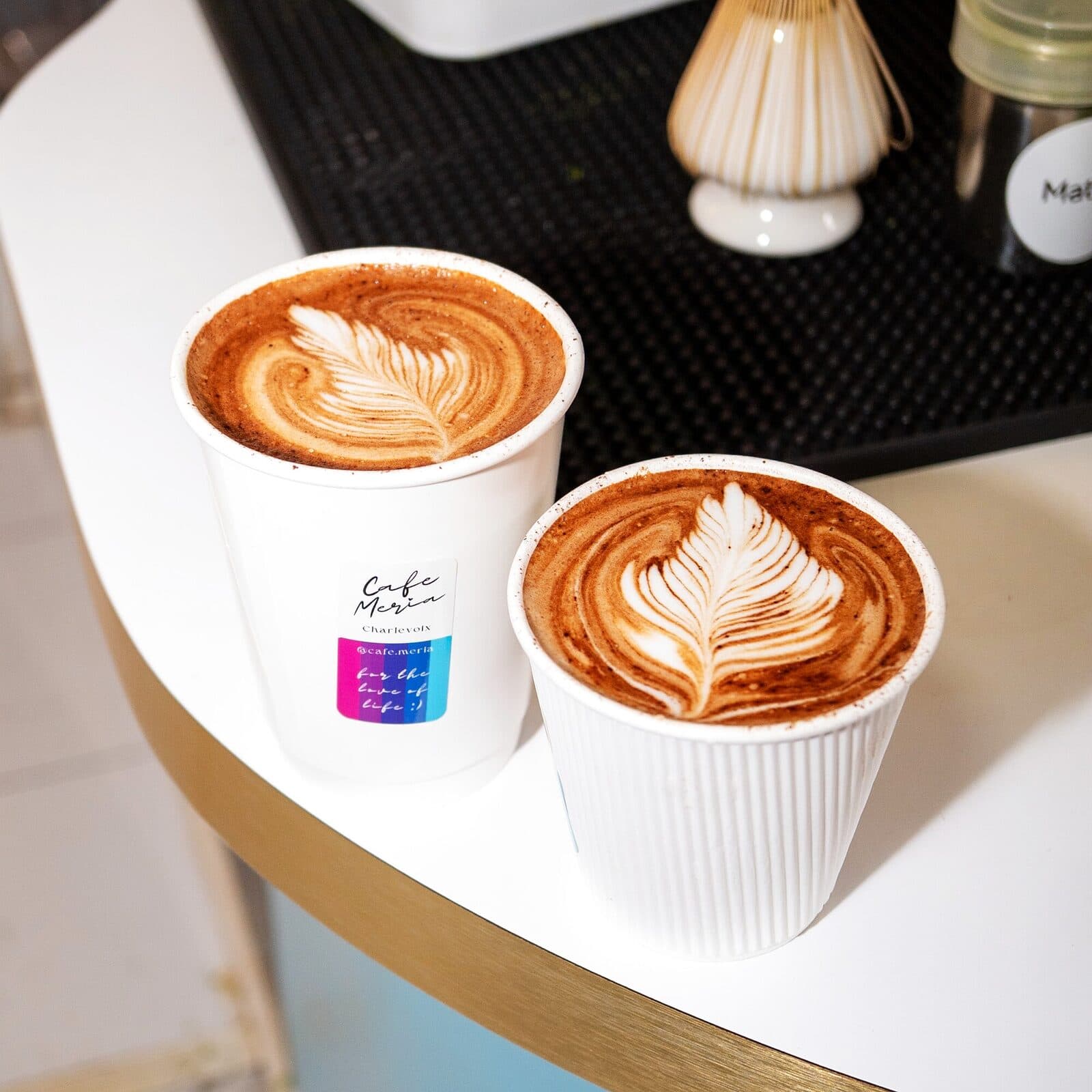 A Cafe Meria mocha with fern latte art
